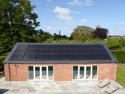 Residential building with a solar panel installation on the roof.