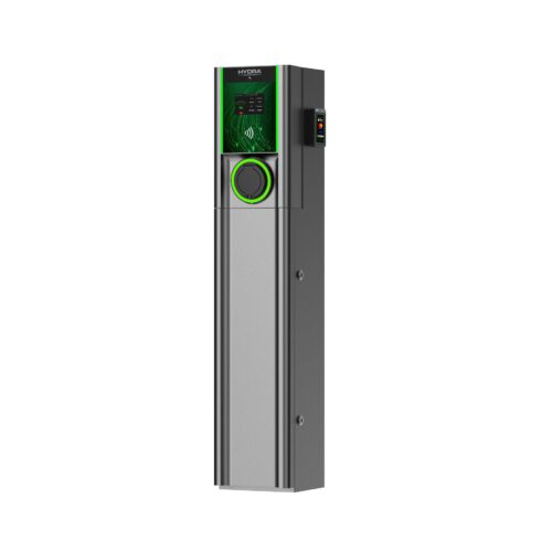 A tall, metallic electric vehicle charging station with a green-lit interface and circular port.